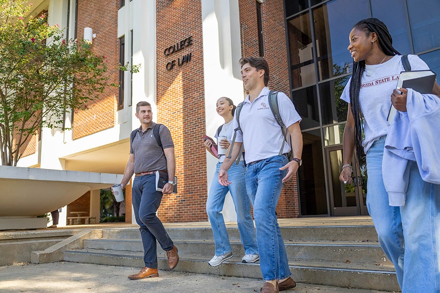 Students in front of the College of Law steps.