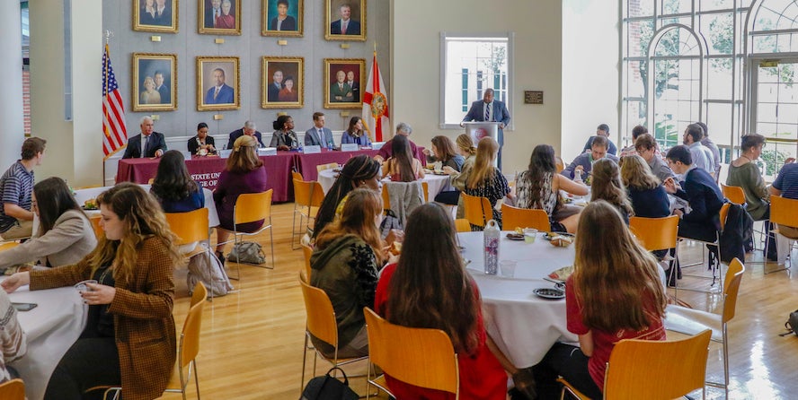 students listening to panel
