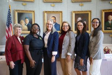 A Photo of Speakers of the Women in Law Symposium Event Posing