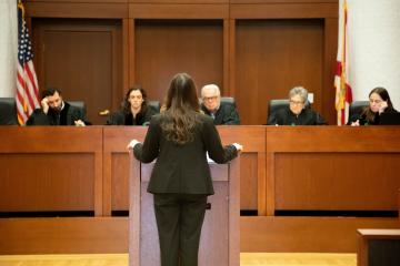 A Photo of FSU Law Student Speaking Before Judges