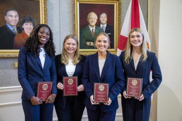 A Photo of FSU Law Students Posing with Their Awards