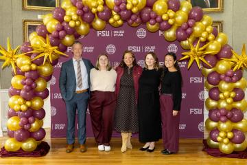 A Photo of Dean Nancy Benavides Posing at her 26th Anniversary Celebration