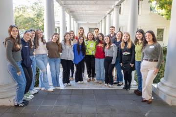 A Photo of Dean Nancy Benavides Posing with FSU Law Students