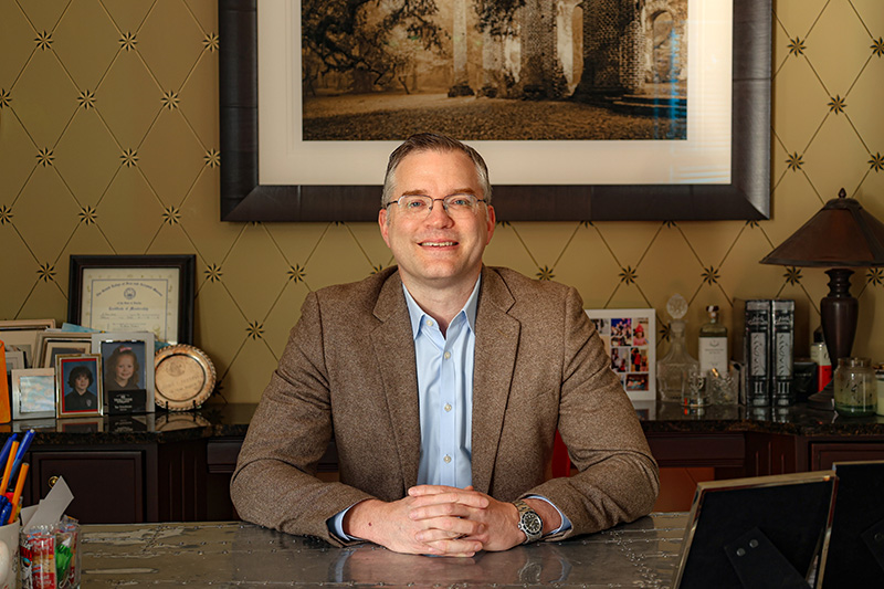 Friedman at desk