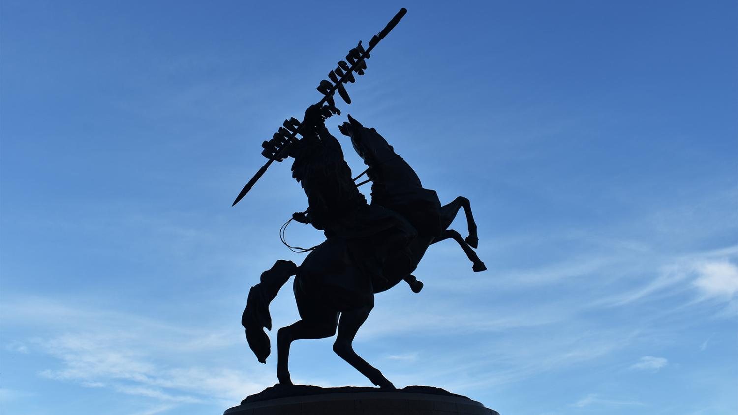 "Unconquered Statue silhouette photo"