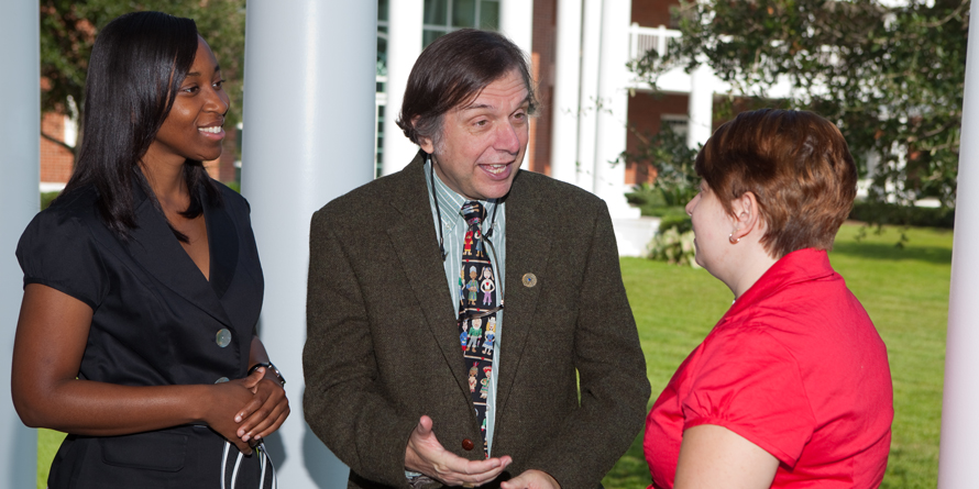 Students speak with professor