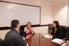 Clinic students meet with a direct representation client to go over advance directives.