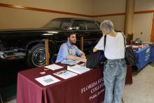 Clinic student Austin Arnold provides resources and information at World Elder Abuse Awareness Day.